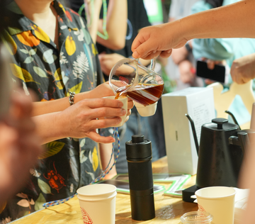 photo of 10K Tastes Global Tasting Event Shenzhen – coffee enthusiasts and legend Long Ge with STARESSO D9+ grinders at Douwu Coffee Longhua