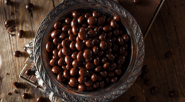 a bowl of chocolate covered espresso beans